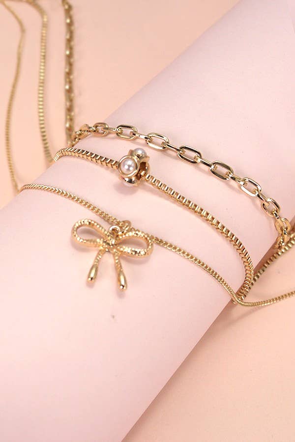 Layered Pearl Necklace with Bow Charm