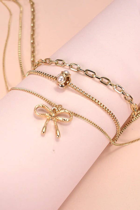 Layered Pearl Necklace with Bow Charm