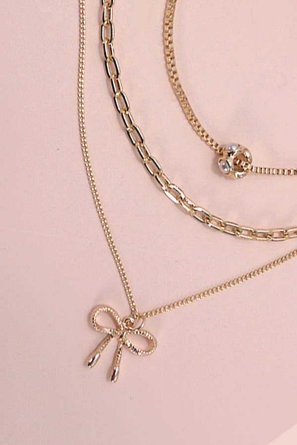 Layered Pearl Necklace with Bow Charm