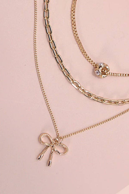 Layered Pearl Necklace with Bow Charm